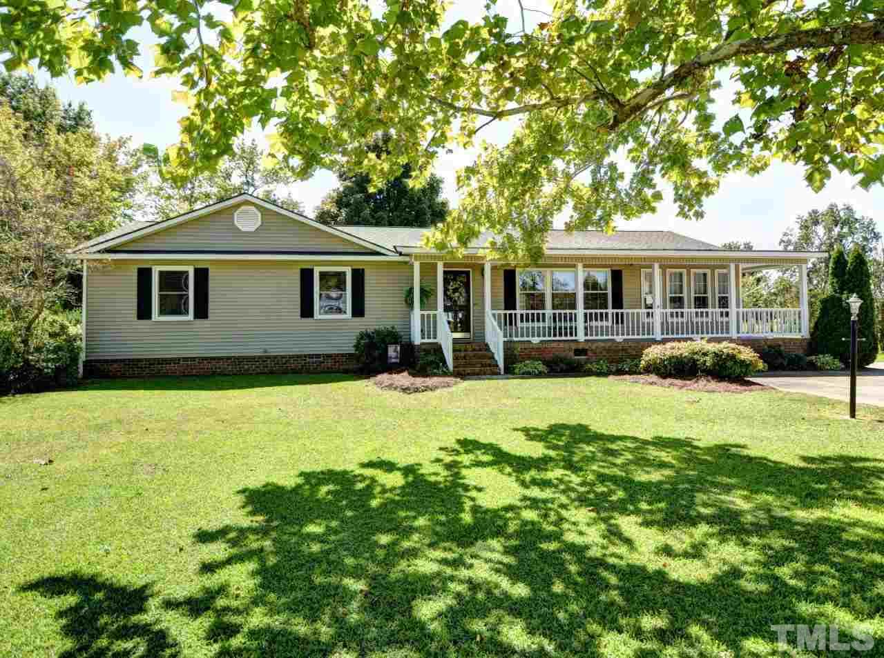 350 Sullivan Road Selma, NC 27576 - Photo 1 of 25 Beautiful Wrap porch with rows of windows providing natural sunlight.