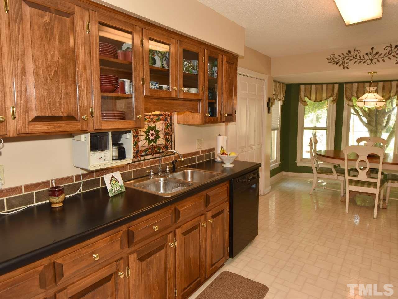 350 Sullivan Road Selma, NC 27576 - Photo 13 of 25 Kkitchen cabinets w/glass fronts for displaying special glassware , china or special treasures.