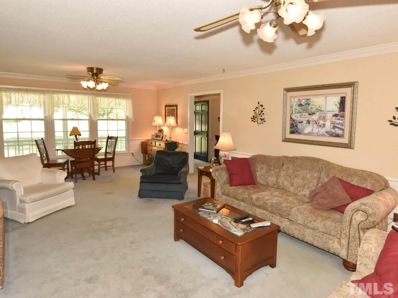 350 Sullivan Road Selma, NC 27576 - Photo 3 of 25 Family room with builtins and brick hearth w/closed fireplace