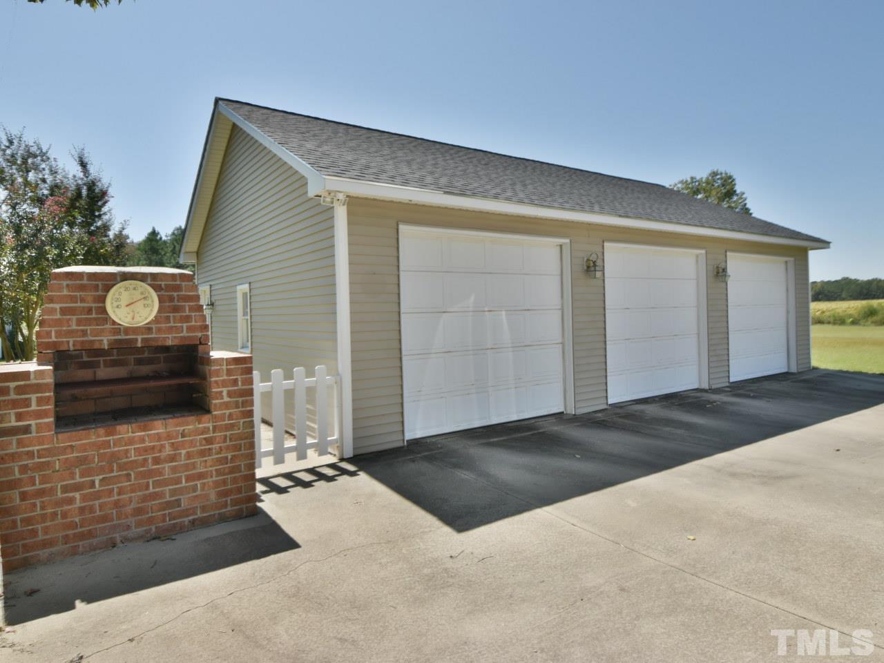 350 Sullivan Road Selma, NC 27576 - Photo 22 of 25 Detached 3 car garage with 3 roll up doors. Concrete floor. So much storage space for you special treasures.