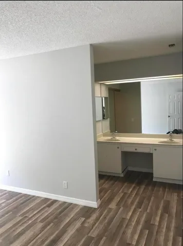 a room with a bench and vanity