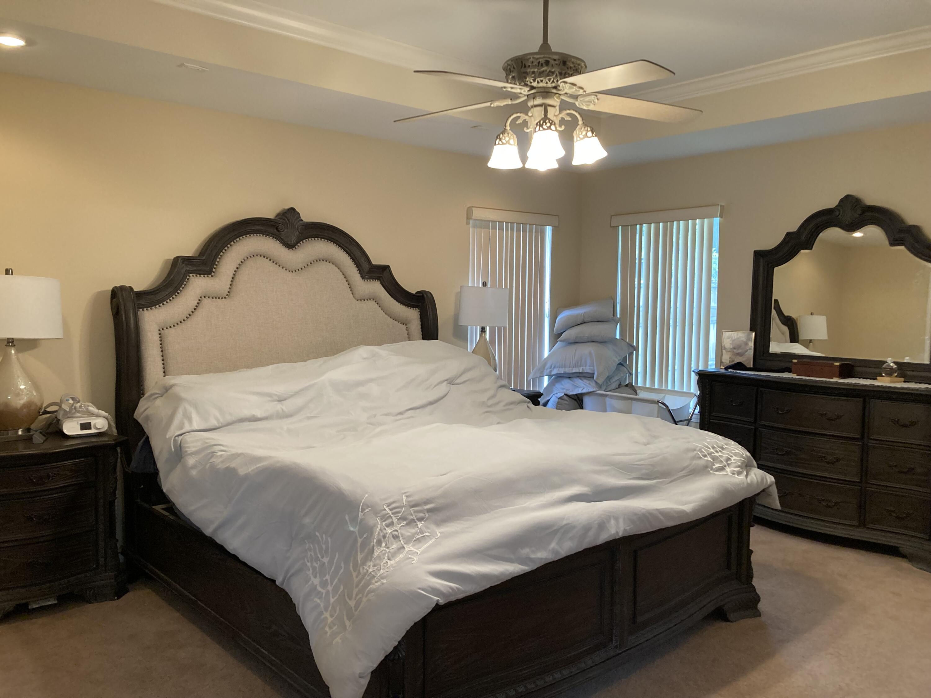10 Maple Avenue Shalimar, FL 32579 - Photo 16 of 21 a bedroom with a bed and a dresser