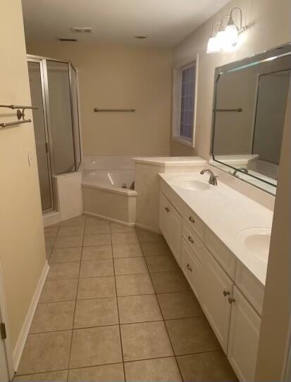 10 Maple Avenue Shalimar, FL 32579 - Photo 17 of 21 a bathroom with a double vanity sink toilet mirror and tub