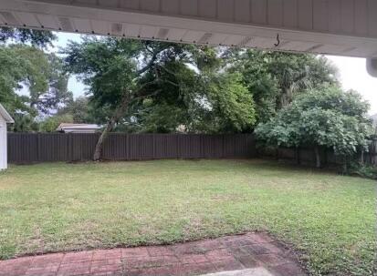 10 Maple Avenue Shalimar, FL 32579 - Photo 19 of 21 a backyard with a plants and tree