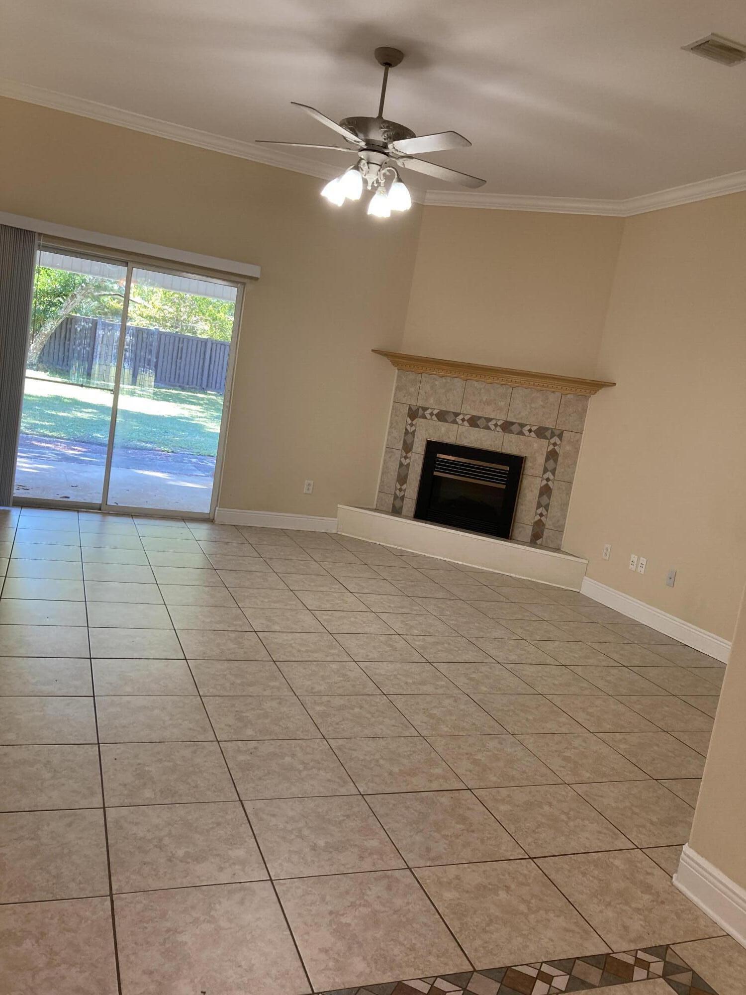10 Maple Avenue Shalimar, FL 32579 - Photo 9 of 21 a view of an empty room with glass door
