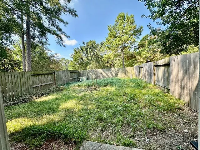a backyard of a house with lots of green space