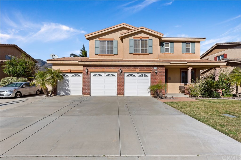15116 Fox Ridge Drive Fontana, CA 92336 - Photo 1 of 1 front view of a house with a yard
