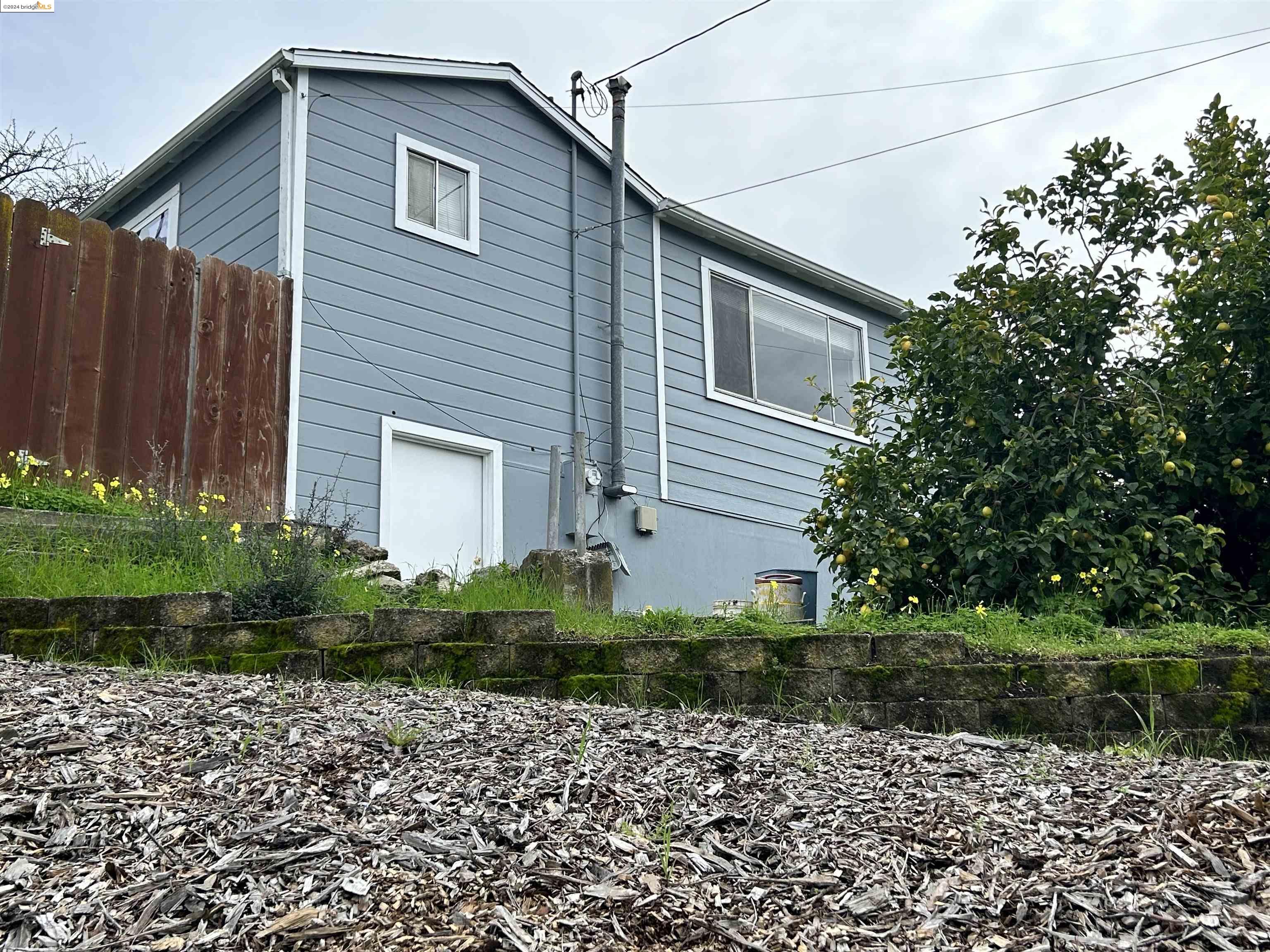 4125 Santa Rita Road El Sobrante, CA 94803 - Photo 1 of 1 a front view of a house with garden