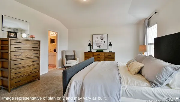 a bedroom with a bed and furniture