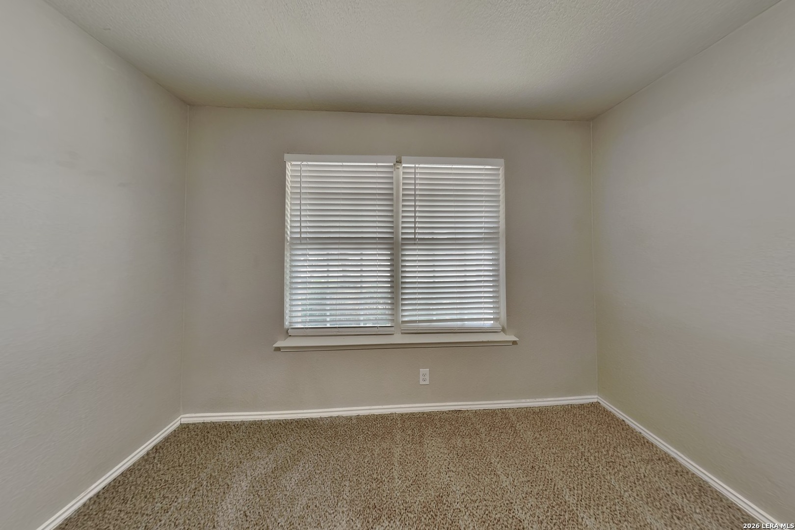 6510 Poseidon Way Converse, TX 78109 - Photo 9 of 16 an empty room with a window