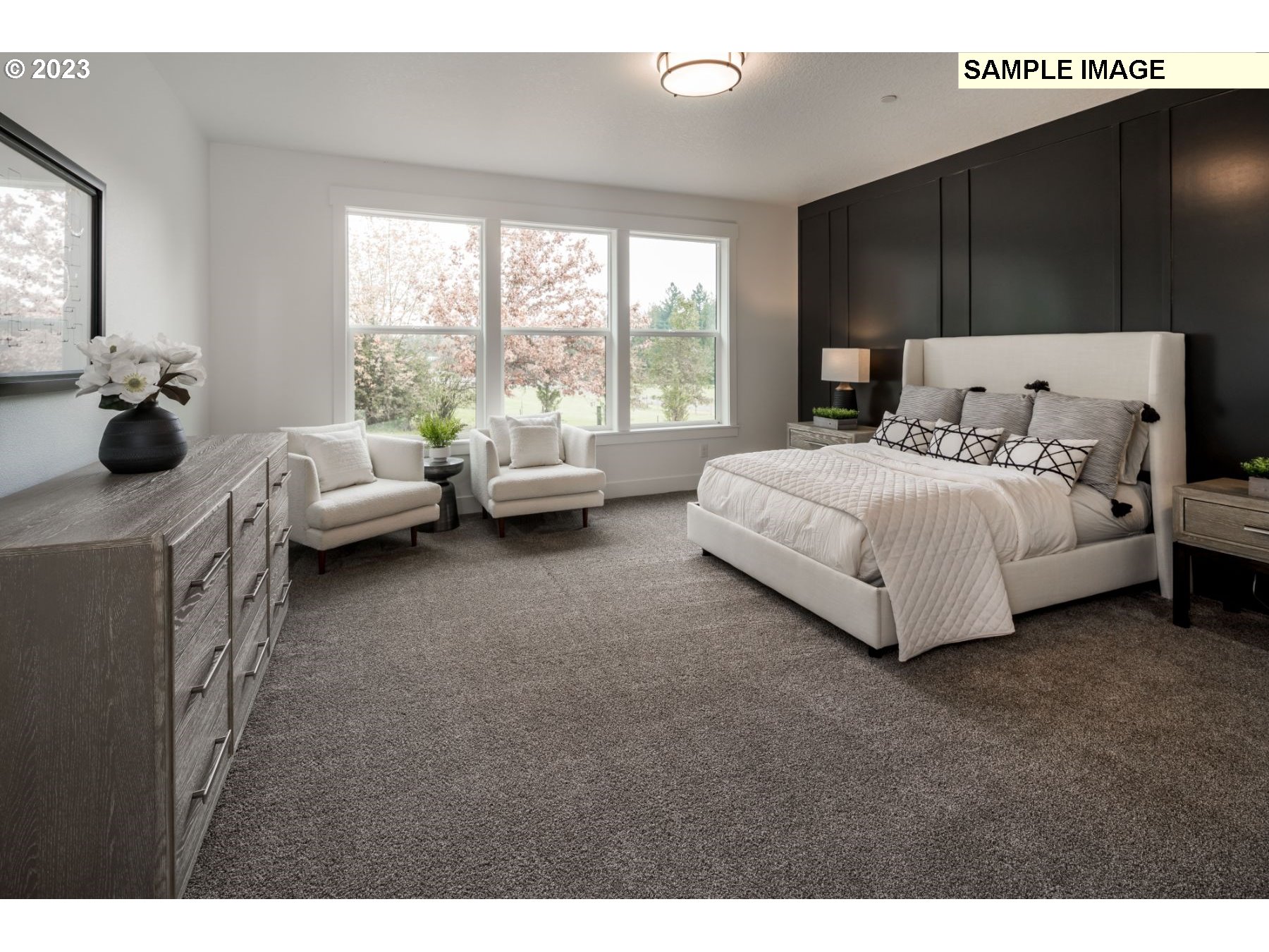1208 South 48th Place Ridgefield, WA 98642 - Photo 13 of 21 a spacious bedroom with a bed and large windows