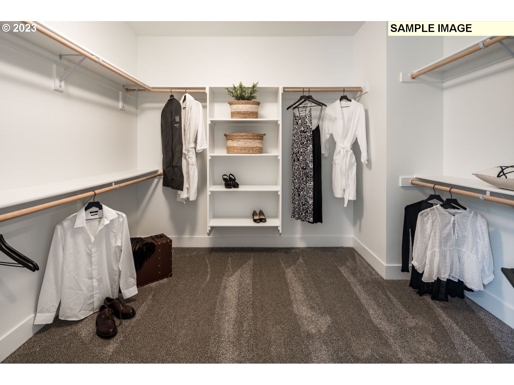 1208 South 48th Place Ridgefield, WA 98642 - Photo 16 of 21 a view of walk in closet with clothes and shoes