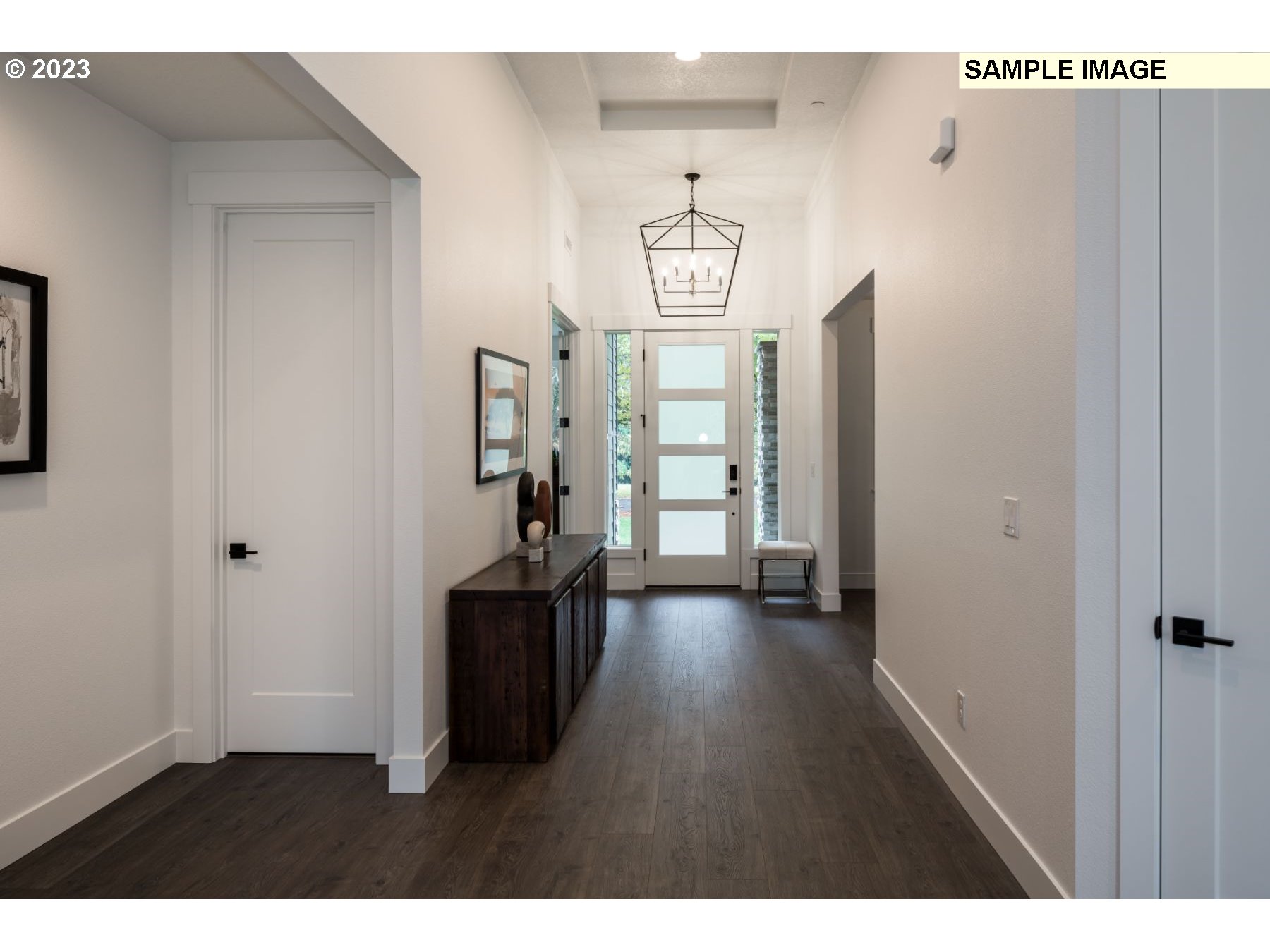 1208 South 48th Place Ridgefield, WA 98642 - Photo 4 of 21 a view of a hallway with wooden floor