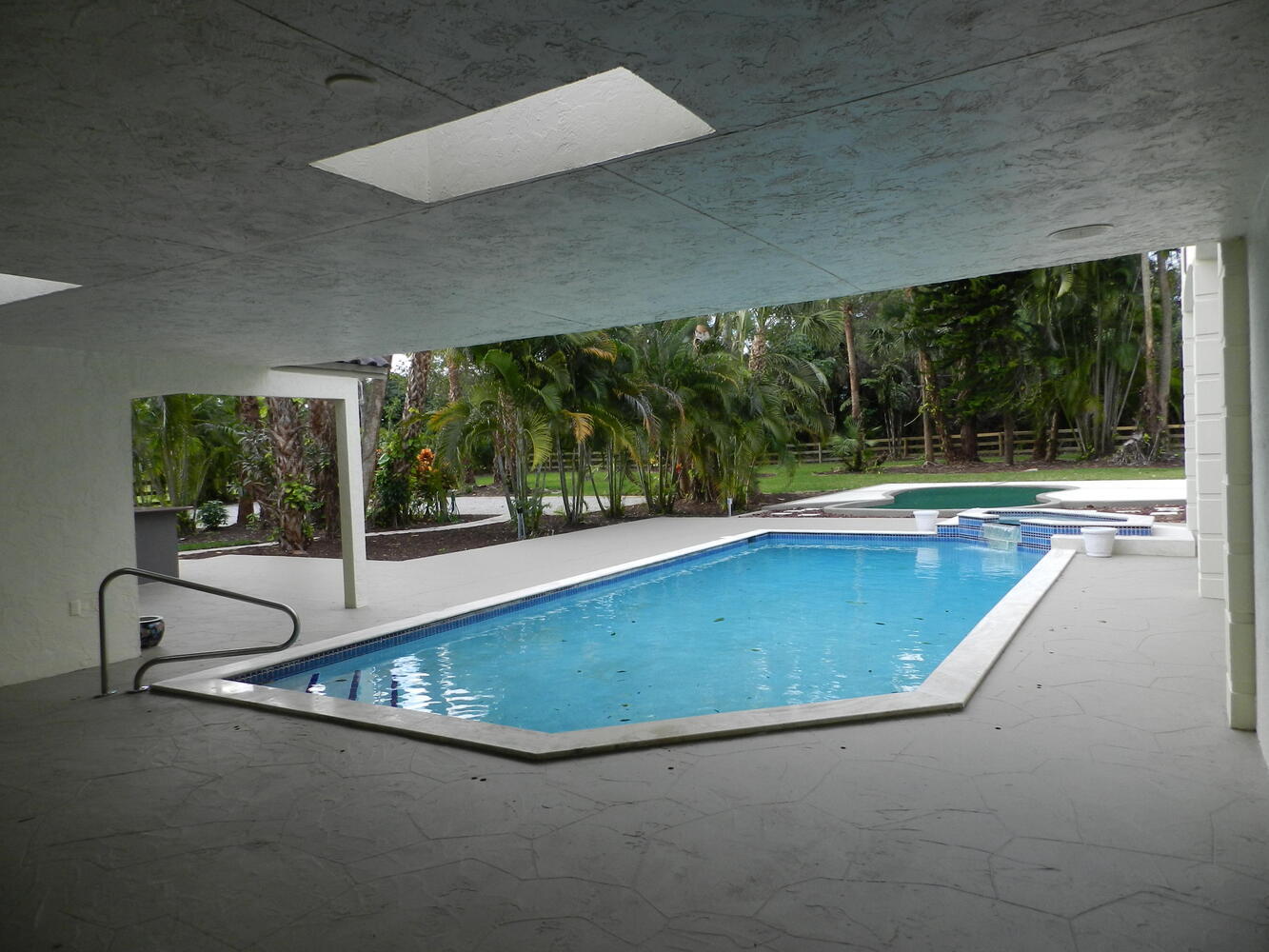 12677 Pineacre Lane Wellington, FL 33414 - Photo 11 of 38 a view of a swimming pool and outdoor space