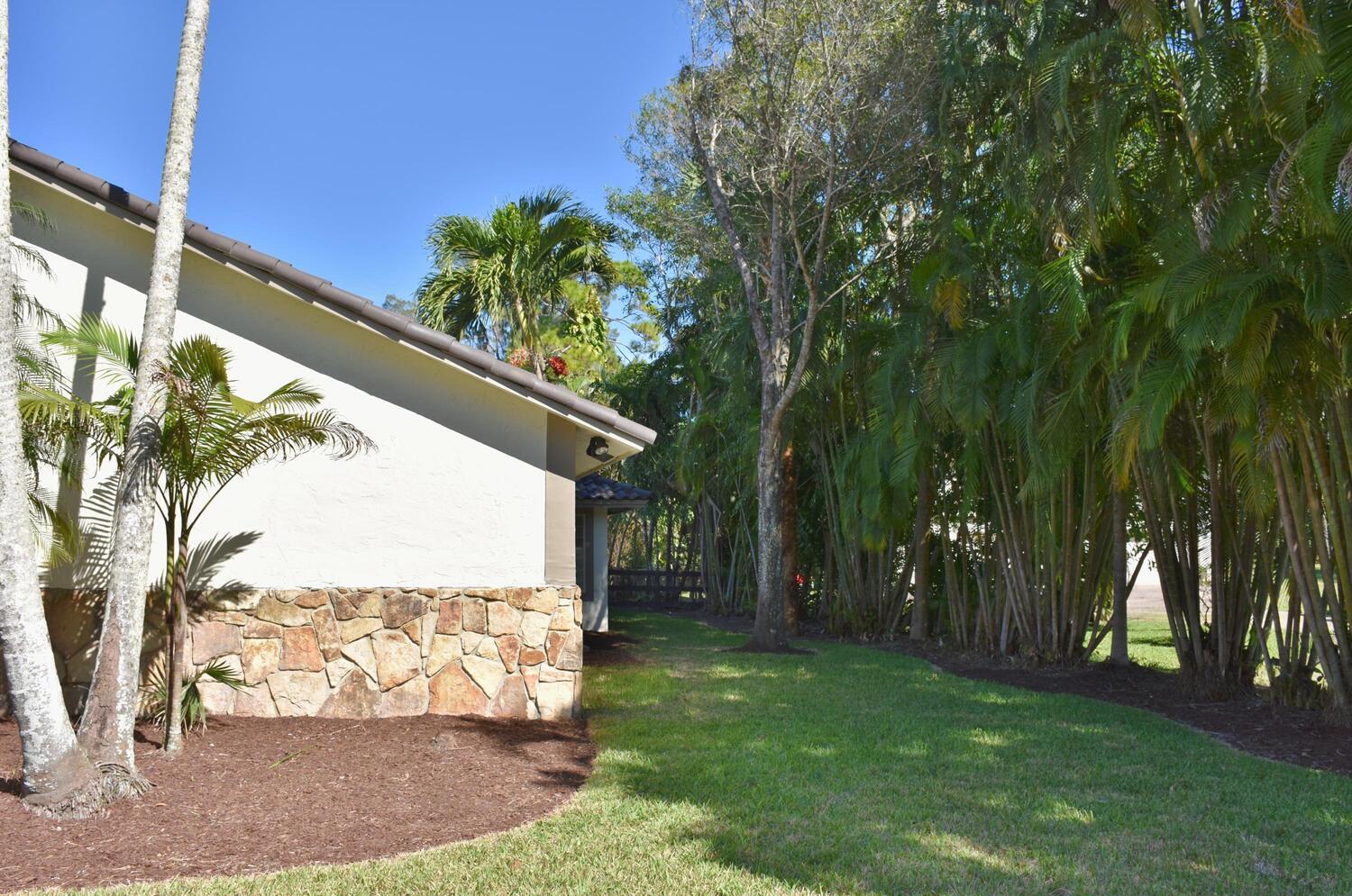 12677 Pineacre Lane Wellington, FL 33414 - Photo 15 of 38 a view of a backyard