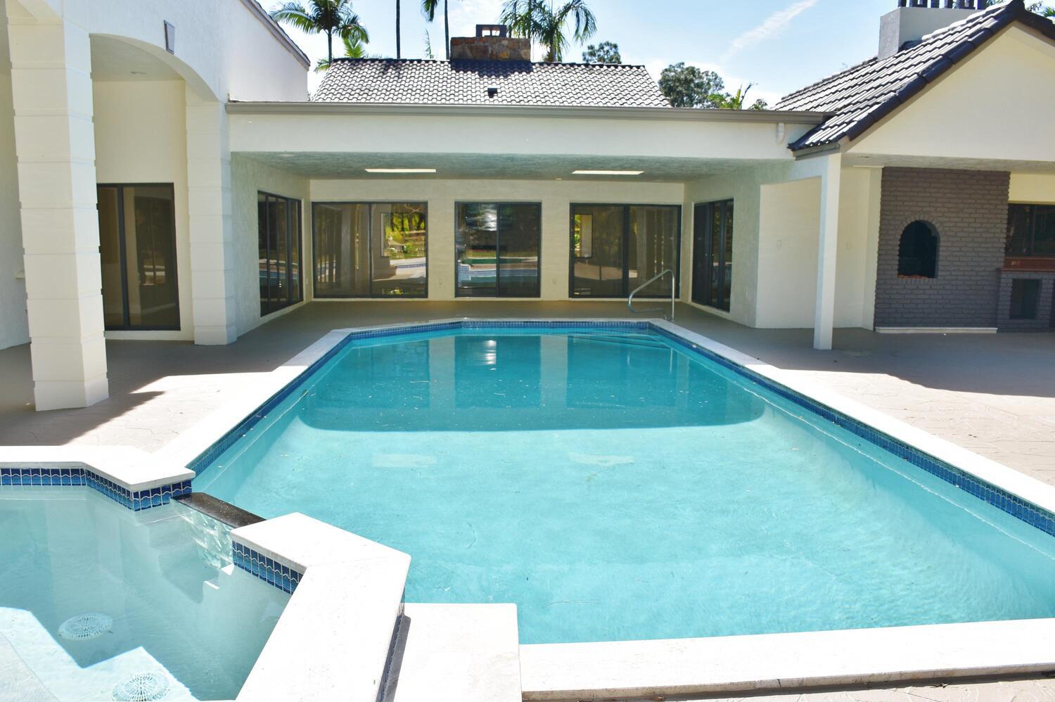 12677 Pineacre Lane Wellington, FL 33414 - Photo 23 of 38 a view of pool with outdoor seating