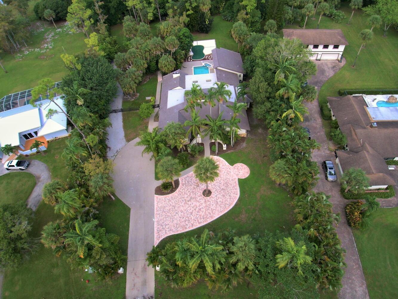 12677 Pineacre Lane Wellington, FL 33414 - Photo 32 of 38 an aerial view of a house with outdoor space