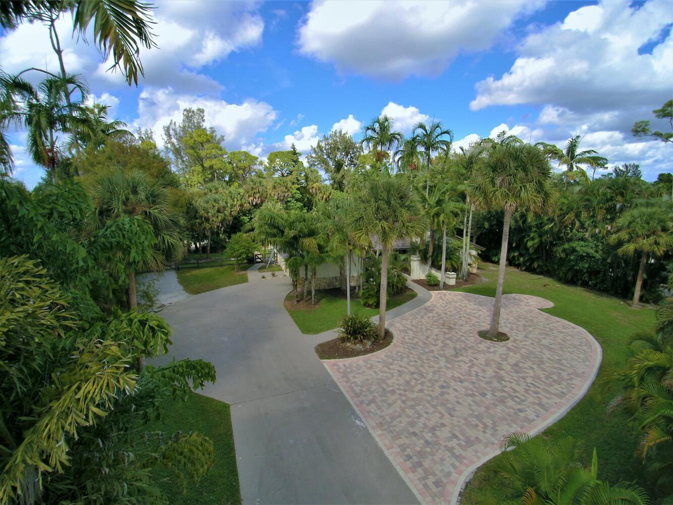 12677 Pineacre Lane Wellington, FL 33414 - Photo 33 of 38 a view of a garden