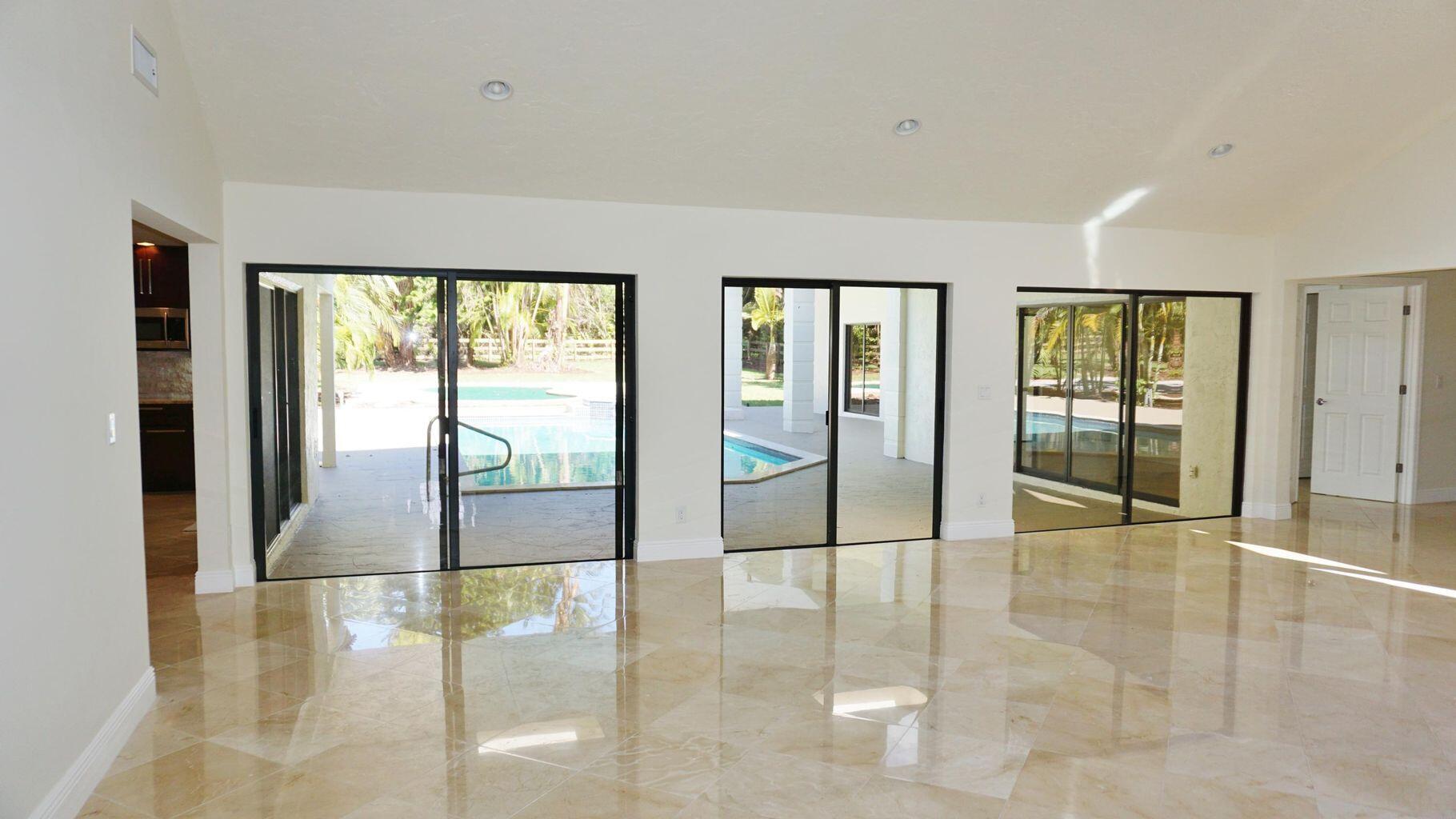 12677 Pineacre Lane Wellington, FL 33414 - Photo 6 of 38 a view of an entryway of a livingroom
