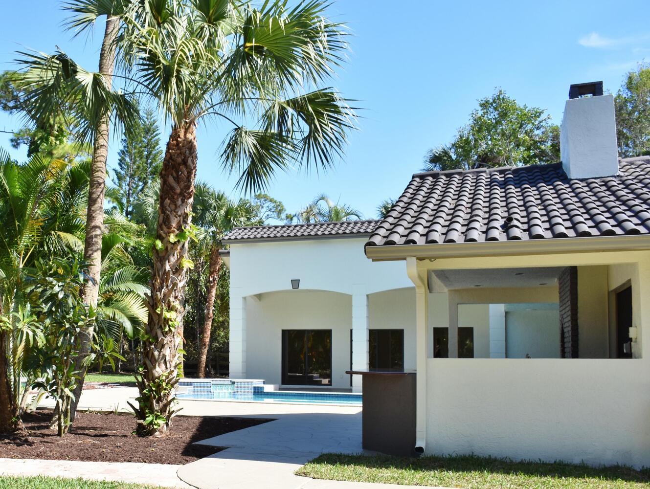 12677 Pineacre Lane Wellington, FL 33414 - Photo 10 of 38 a view of a house with a yard