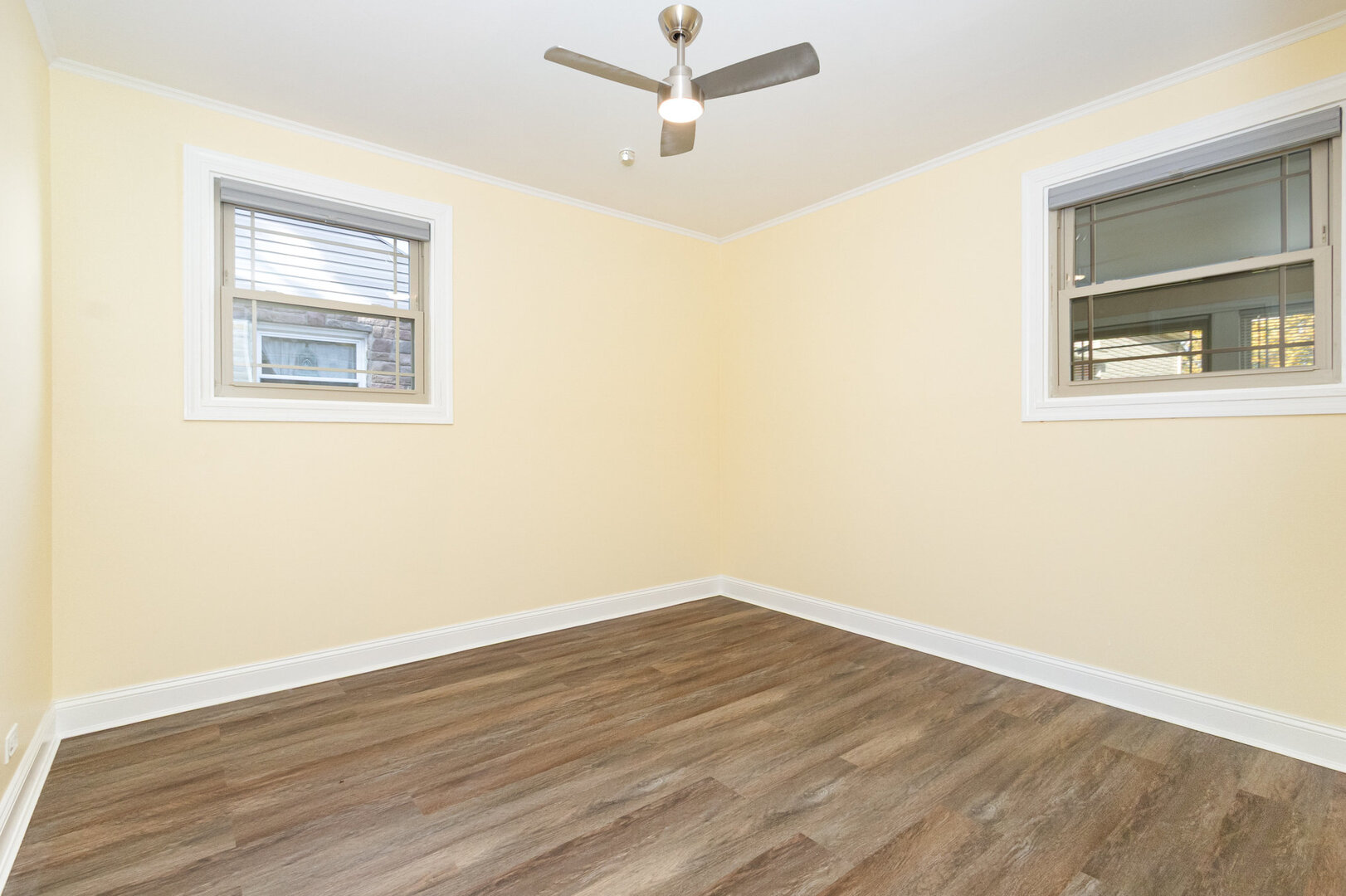 2514 Spruce Road Homewood, IL 60430 - Photo 12 of 18 an empty room with a window and a ceiling fan