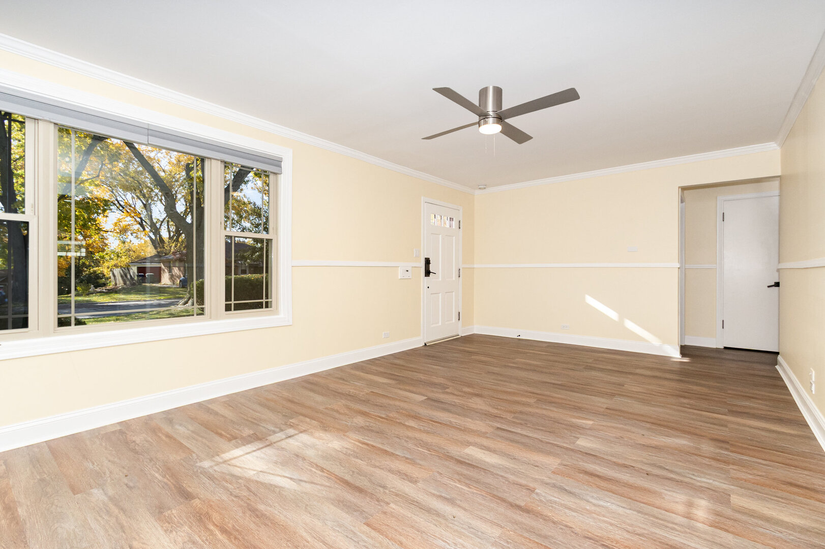2514 Spruce Road Homewood, IL 60430 - Photo 5 of 18 a view of empty room with wooden floor and fan