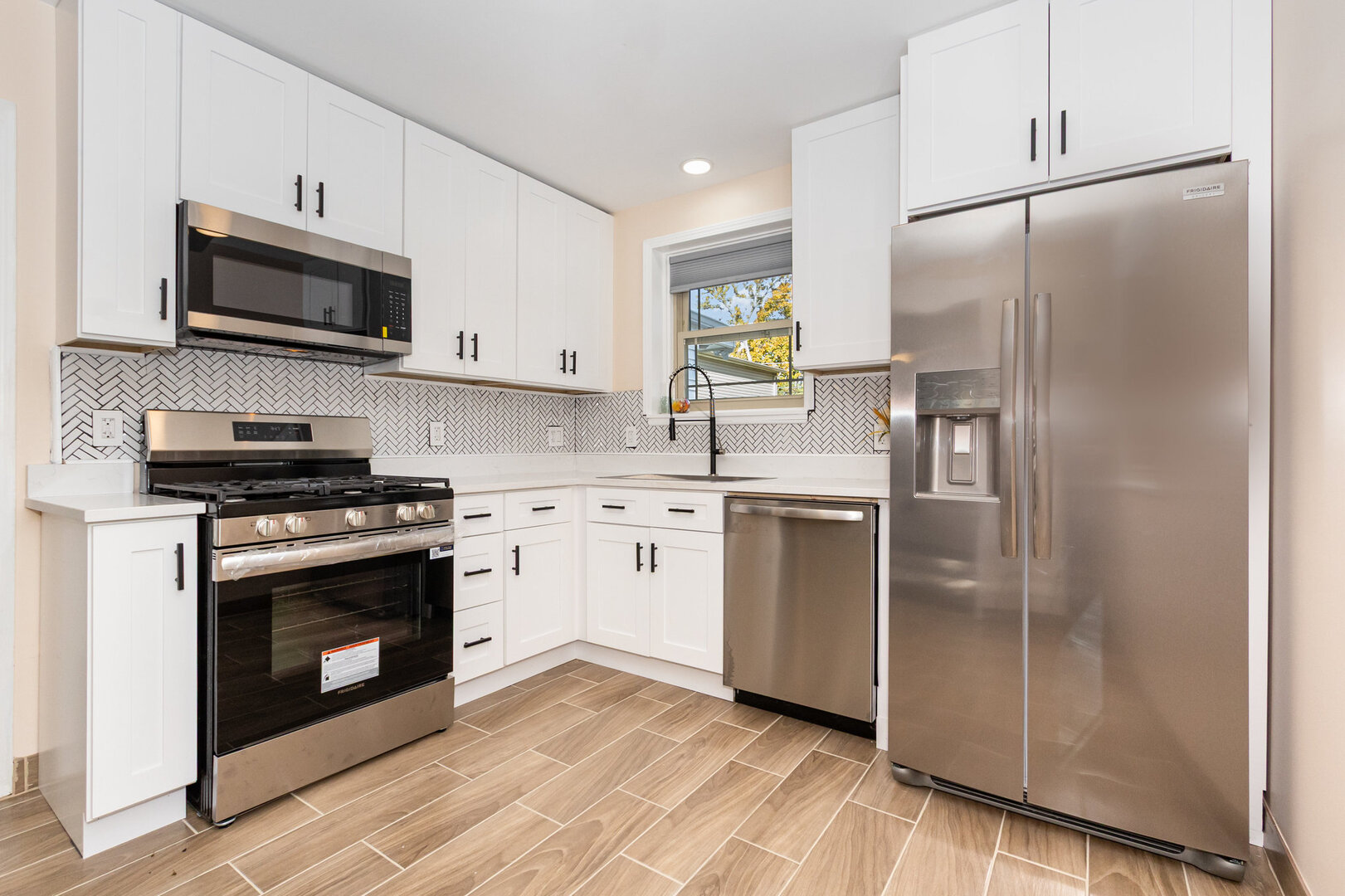 2514 Spruce Road Homewood, IL 60430 - Photo 7 of 18 a kitchen with stainless steel appliances a refrigerator sink and microwave