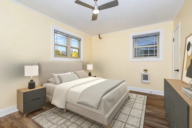 a bedroom with a large bed and a window