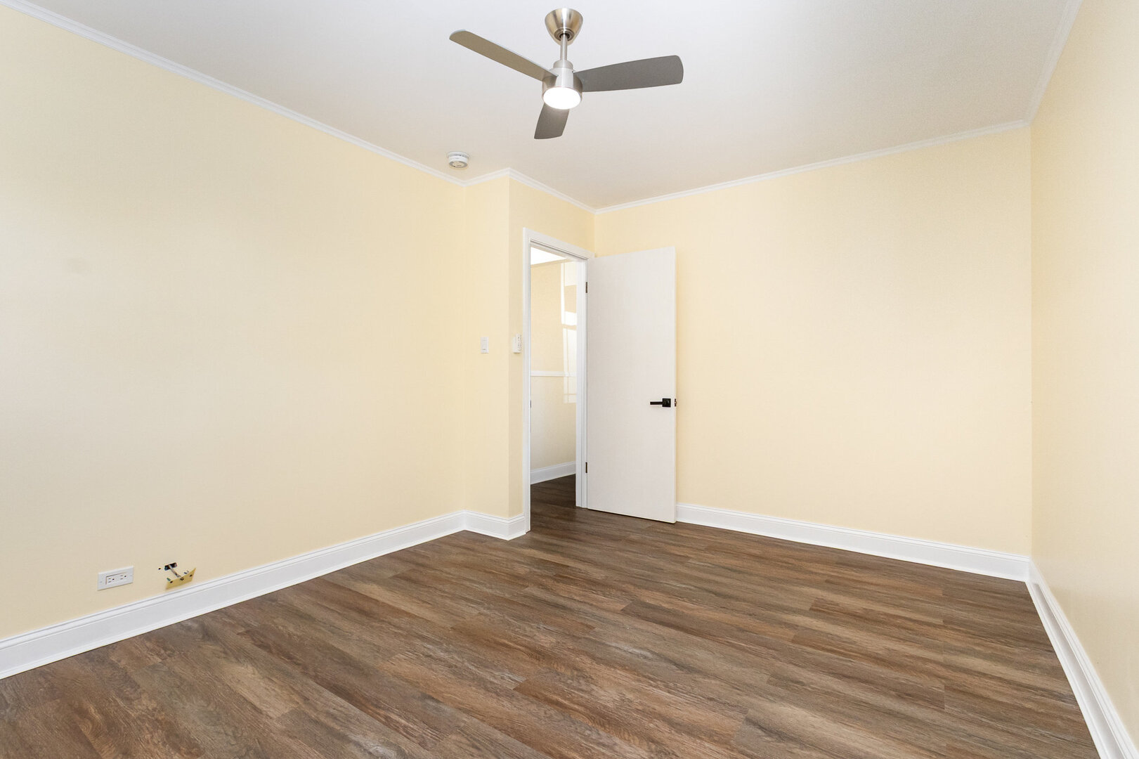 2514 Spruce Road Homewood, IL 60430 - Photo 10 of 18 an empty room with wooden floor and ceiling fan