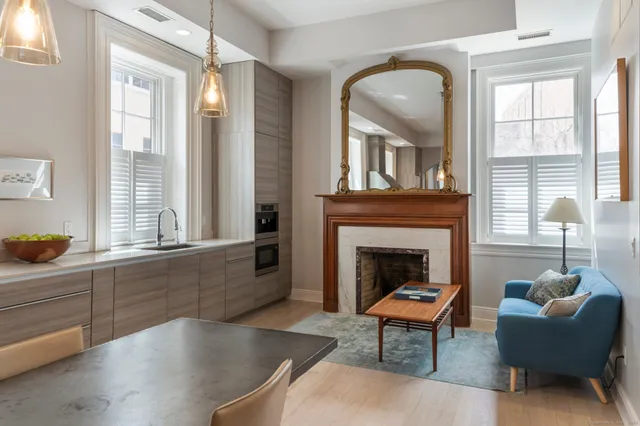 a living room with furniture and a fireplace