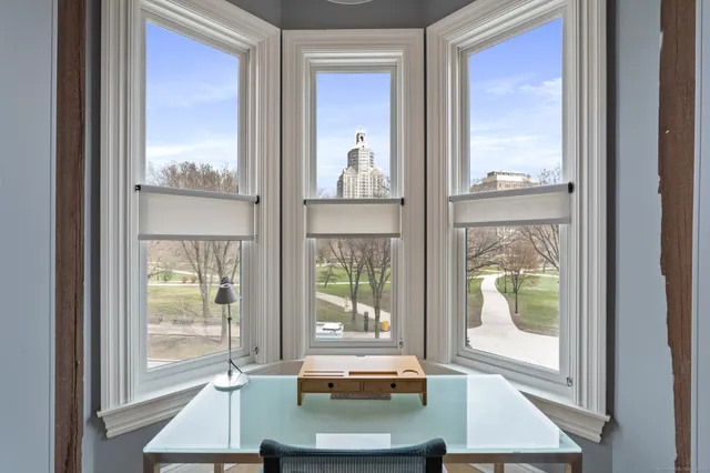 a view of a balcony with chair and glass door
