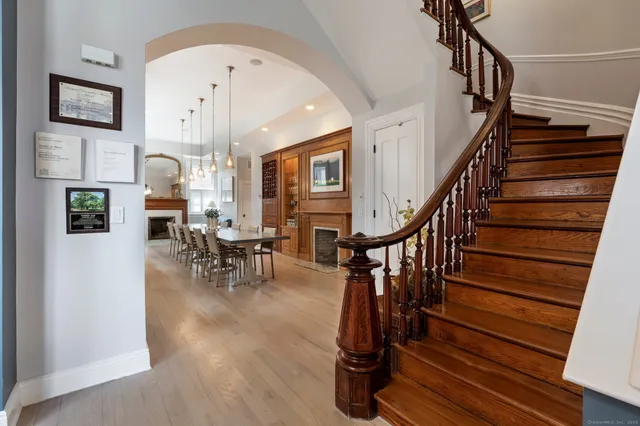 a view of entryway livingroom and hall with wooden floor
