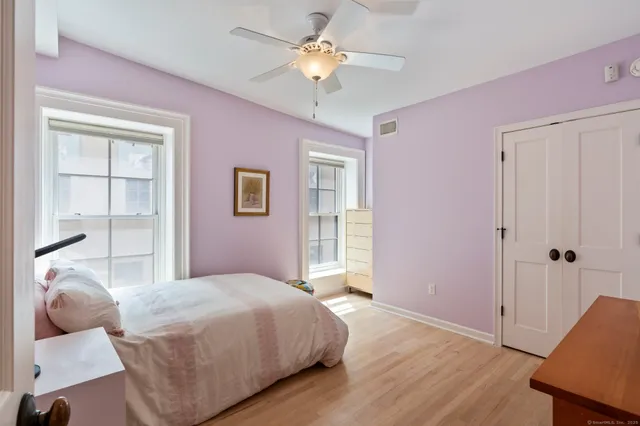 a bedroom with a bed and closet