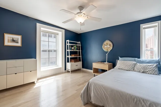 a bedroom with furniture and a window