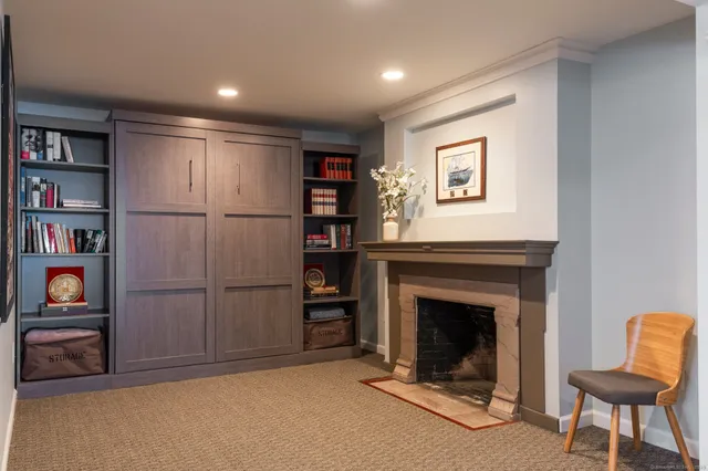 a view of a livingroom with furniture and a fireplace