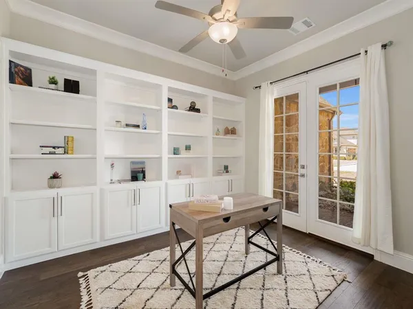 a workspace with wooden floor and furniture