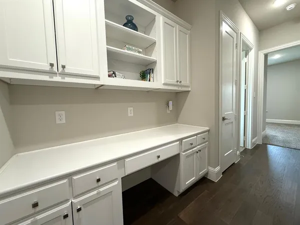 a view of cabinets and wooden floor