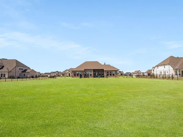a view of a green field with clear sky