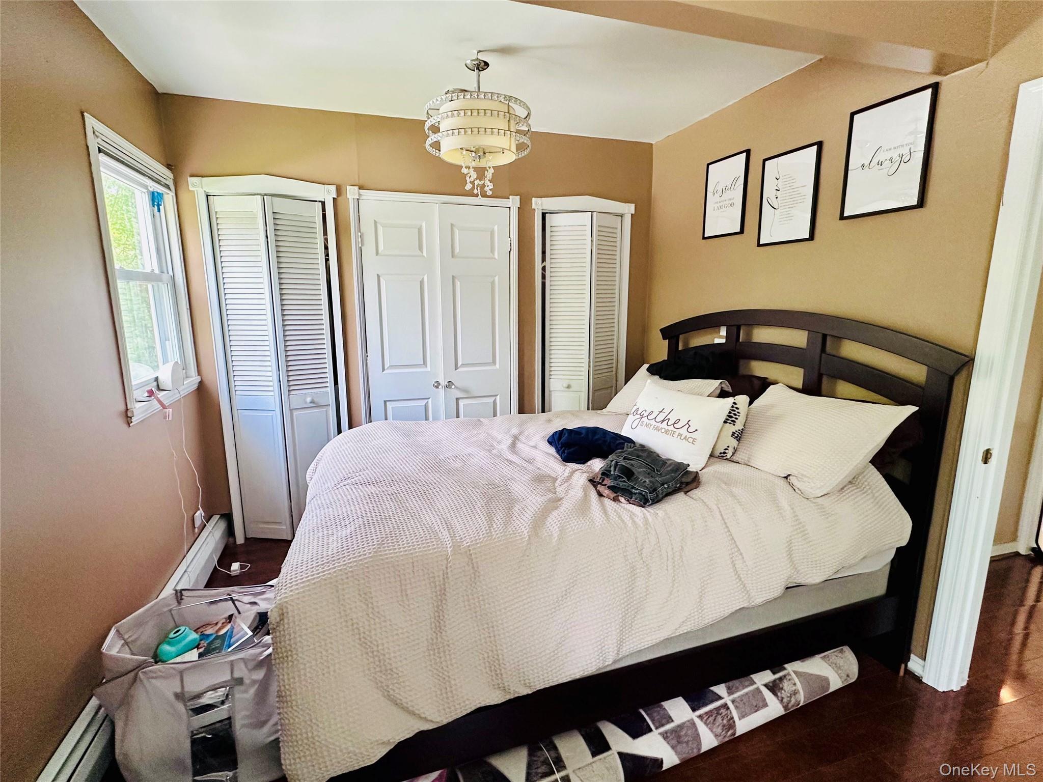 15 Pops Road Cortlandt Manor, NY 10567 - Photo 12 of 14 a bedroom with a bed and dresser with wooden floor