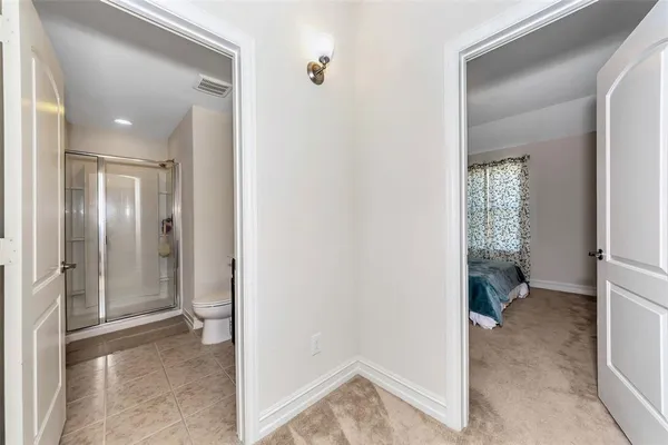 a view of a bathroom from the hallway