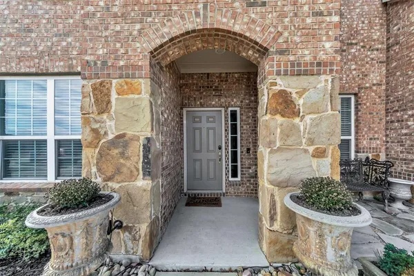 a front view of a house with outdoor shower