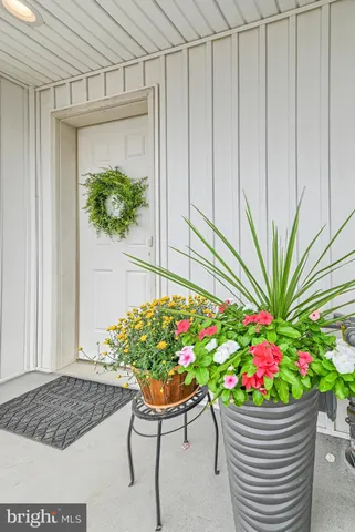 a wooden bench sitting in front of a window