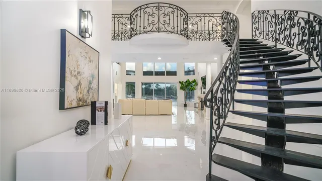 a living room with furniture and a window with outer view