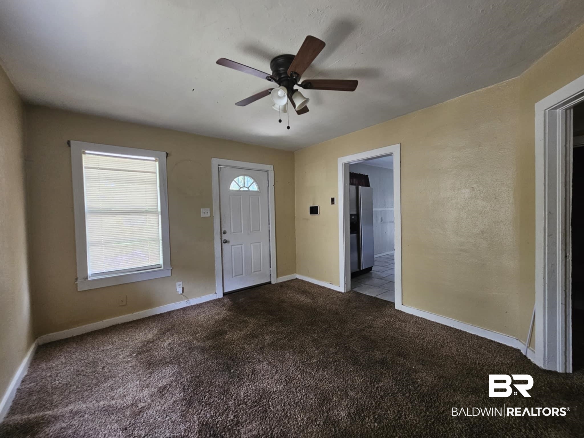 2253 Barlow Street Mobile, AL 36617 - Photo 8 of 10 Foyer entrance with ceiling fan, carpet, and baseboards