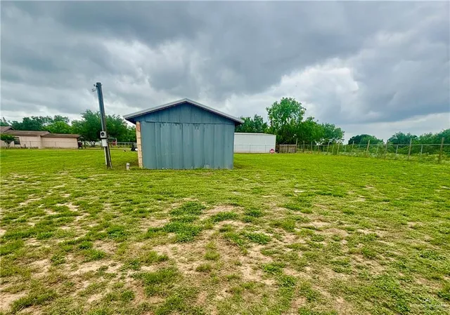 a view of a back yard of the house