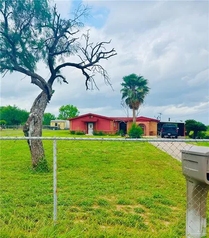 a view of a swimming pool with a yard