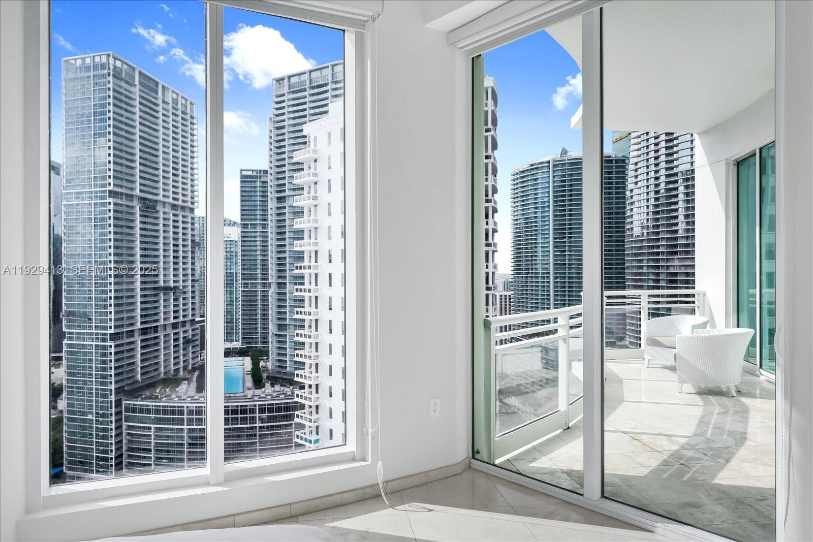 900 Brickell Key Boulevard, Unit 2605 Miami, FL 33131 - Photo 17 of 43 a view of a balcony with a door