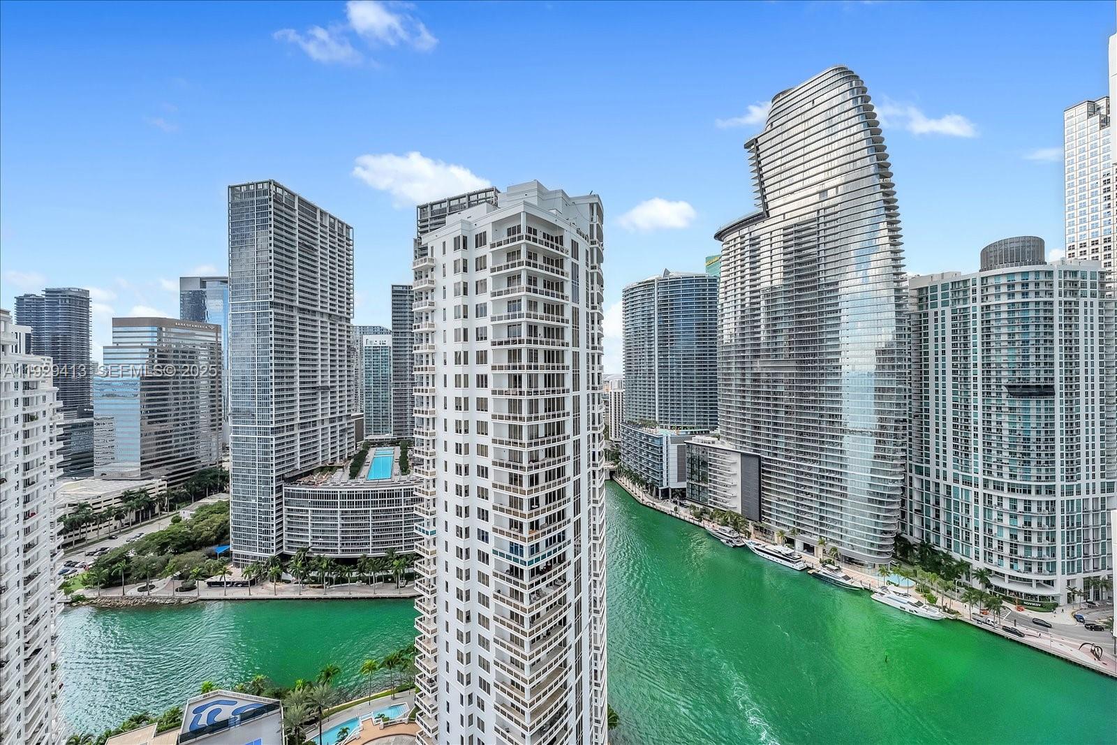 900 Brickell Key Boulevard, Unit 2605 Miami, FL 33131 - Photo 2 of 43 a view of a city with tall buildings