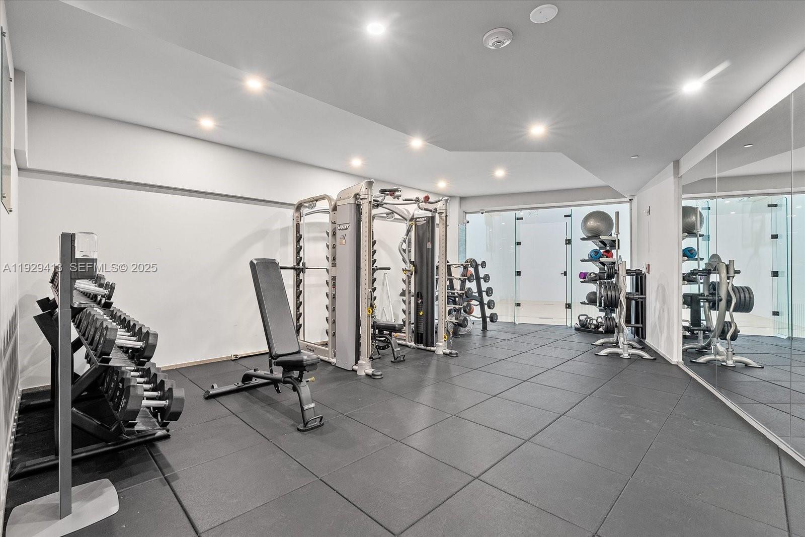 900 Brickell Key Boulevard, Unit 2605 Miami, FL 33131 - Photo 31 of 43 a view of a room with gym equipment