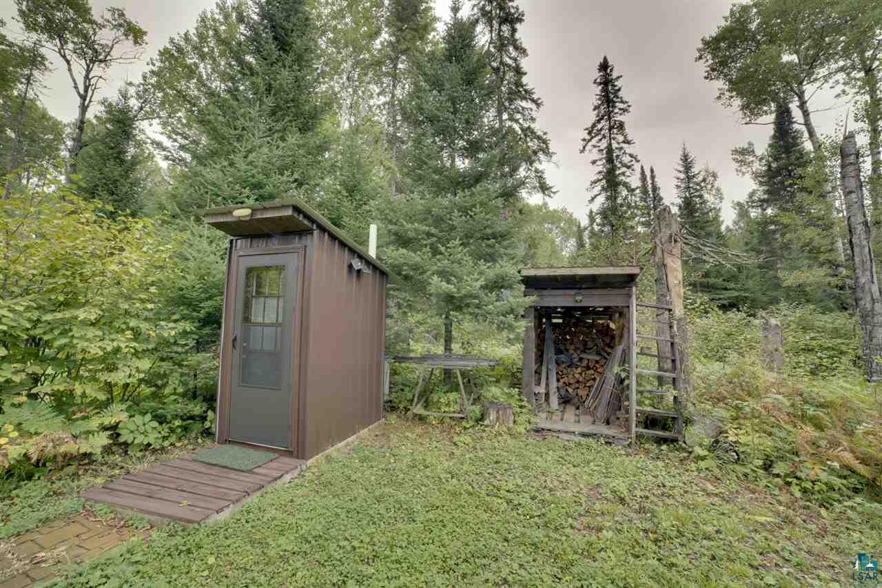 8389 Pulkinen Road Embarrass, MN 55732 - Photo 4 of 14 Outhouse and Woodshed